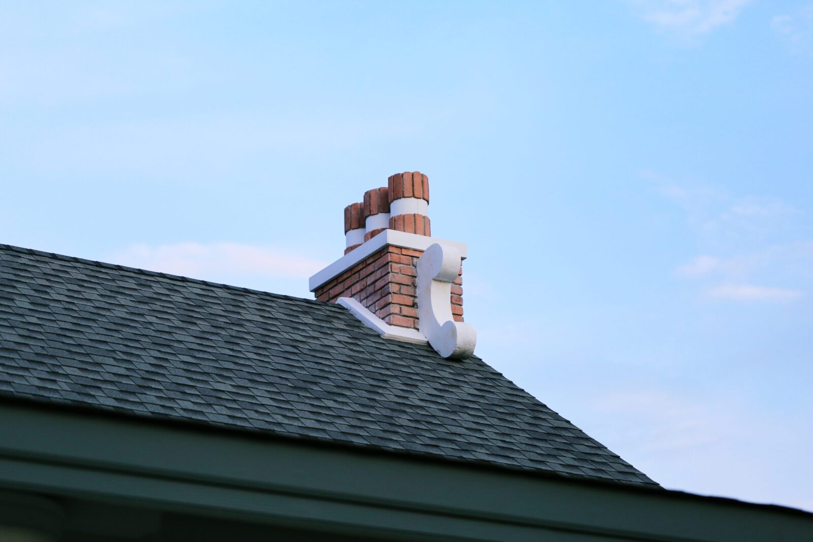 chimney on house roof closeup blue sky background 2021 04 06 03 44 24 utc scaled