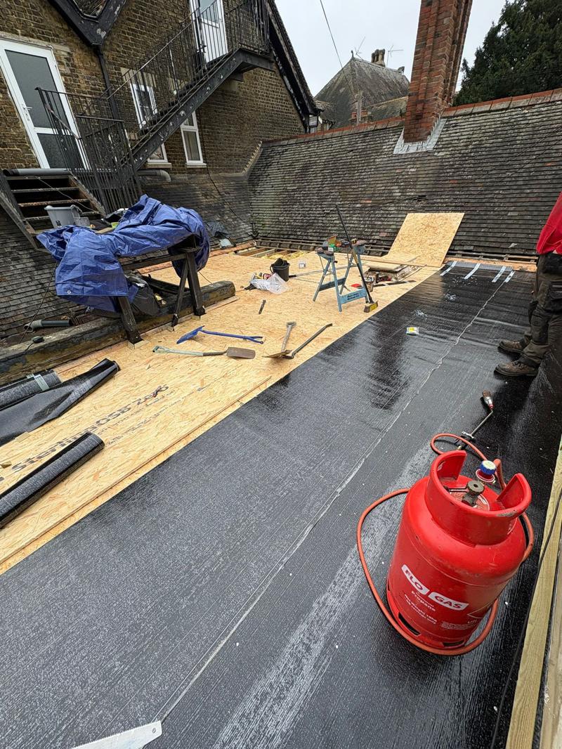 flat roof system with skylight installed in rochester 2